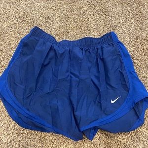 Blue Nike running shorts